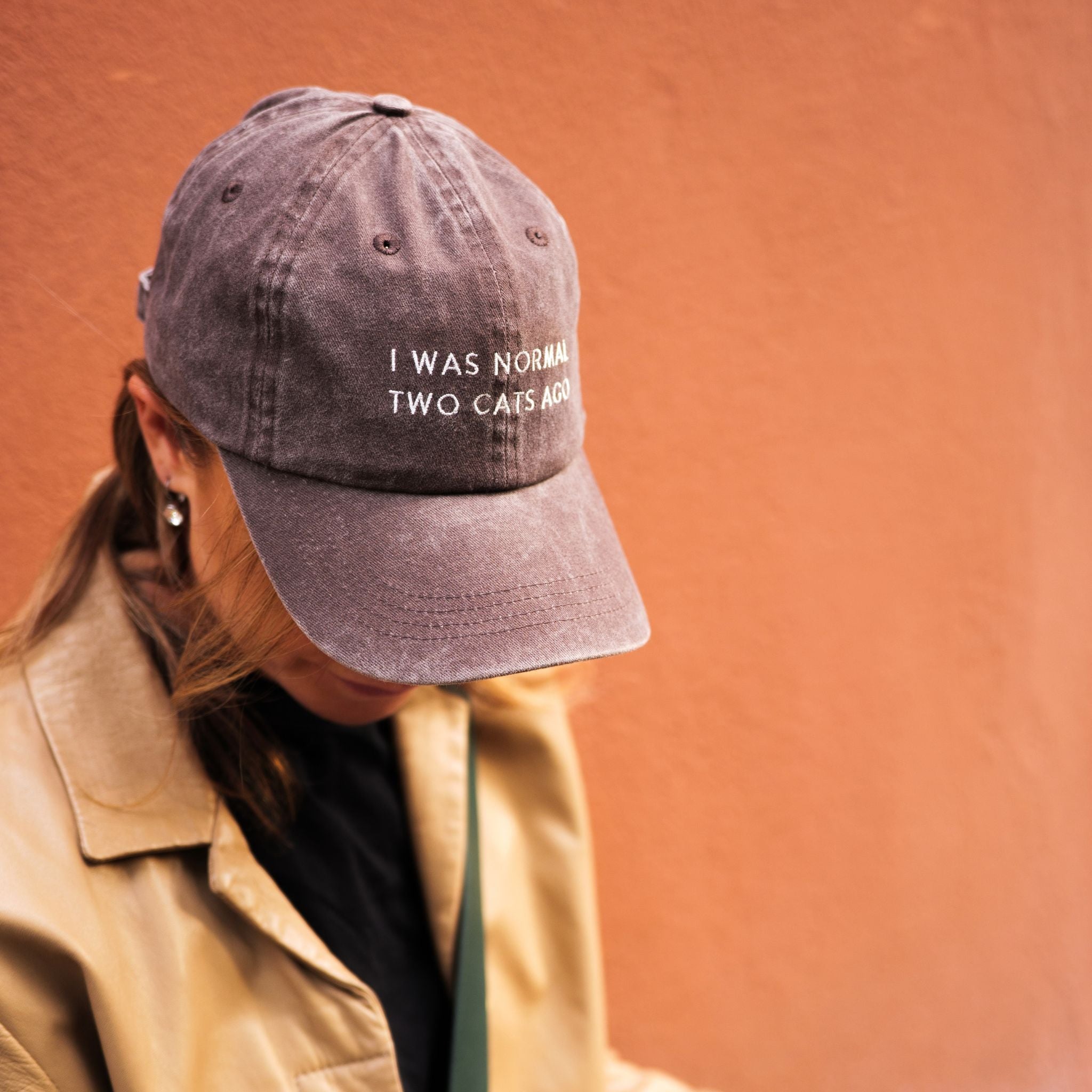 brown-denim-cap-i-was-normal-two-cats-ago-woman-wearing.jpg